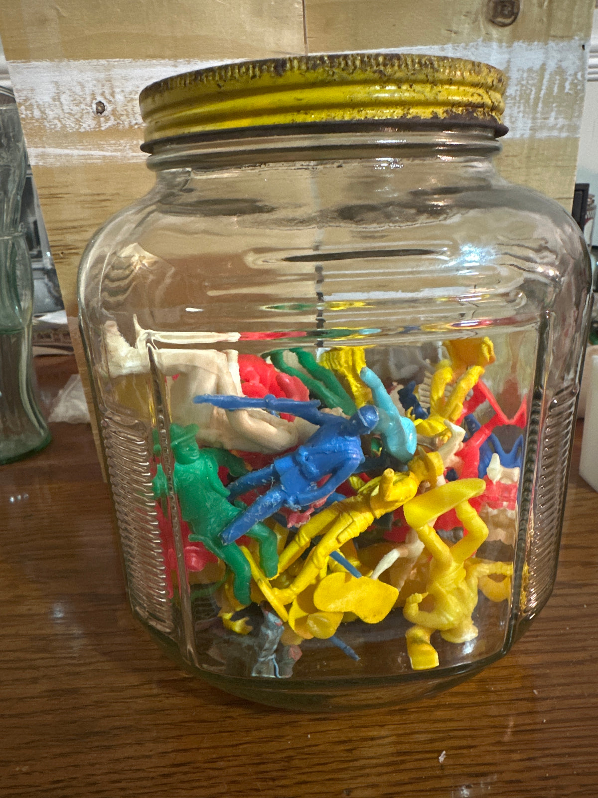 Large jar of toy cowboys and Indians